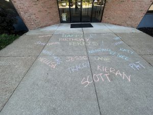 Path with chalk with names and Happy Birthday Ferris written out