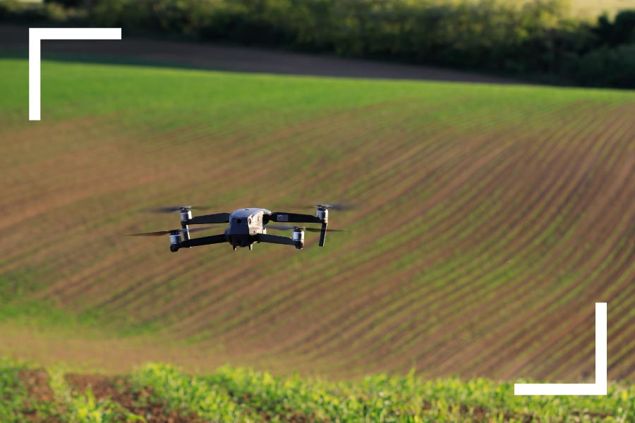 Drone flying over field